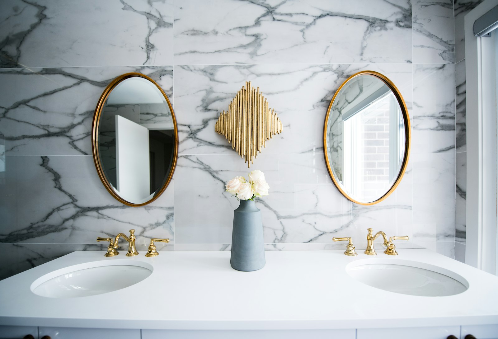 Handyman repairing an interior fixture inside a Queens home